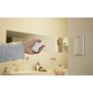 Philips Hue Dimmer Switch in use in a bathroom setting