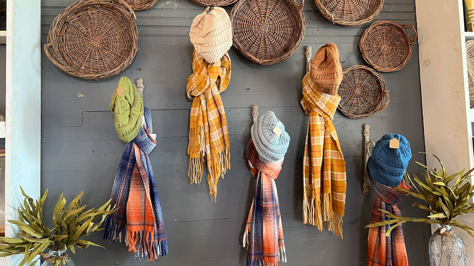 photo of scarves on a wall