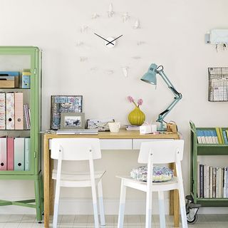 home office room with giant wall clock and white wooden chair