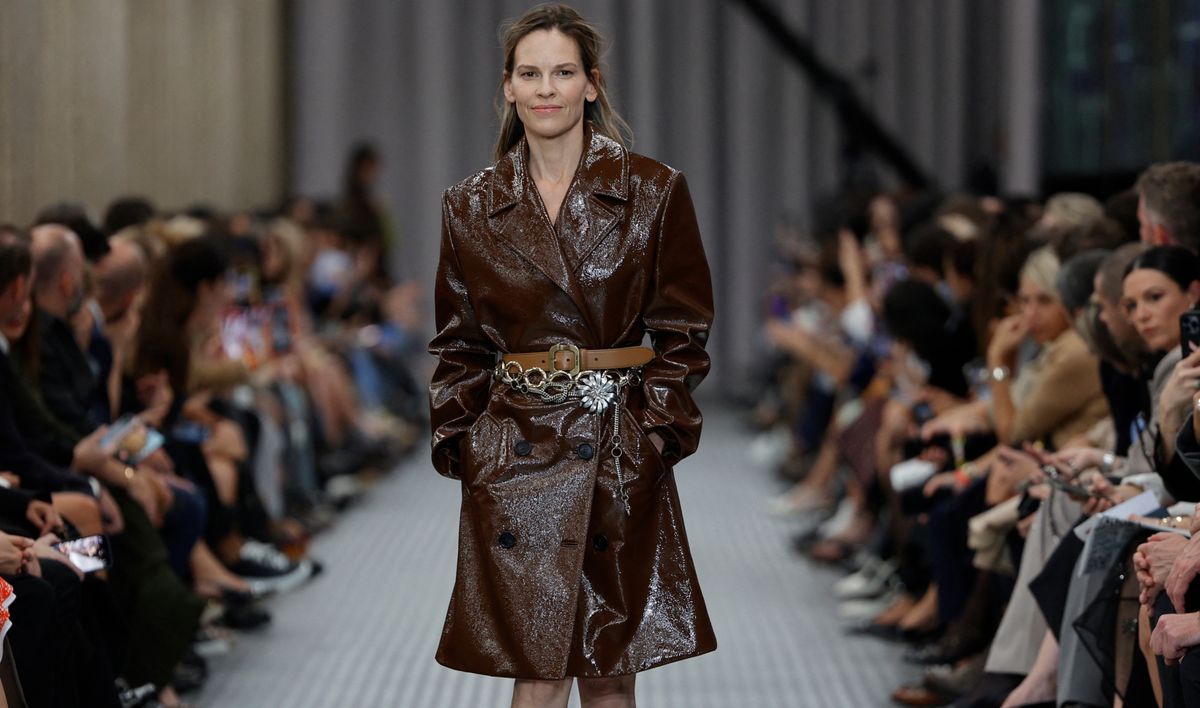 Hilary Swank’s Surprise Miu Miu Runway Walk Features a Triple-Belted Trench Coat and Very Little Makeup