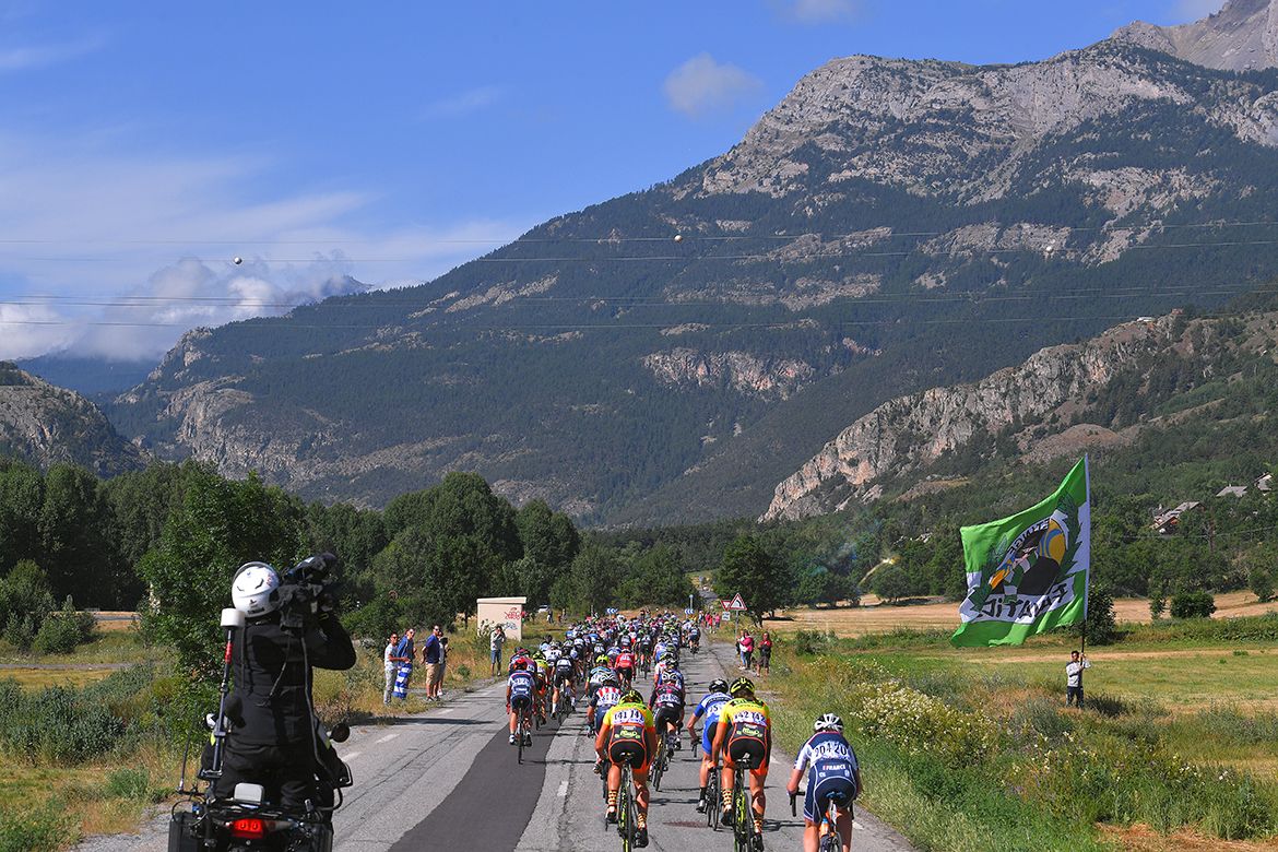 Racing in France is nothing without some enormous flags on the side of the road