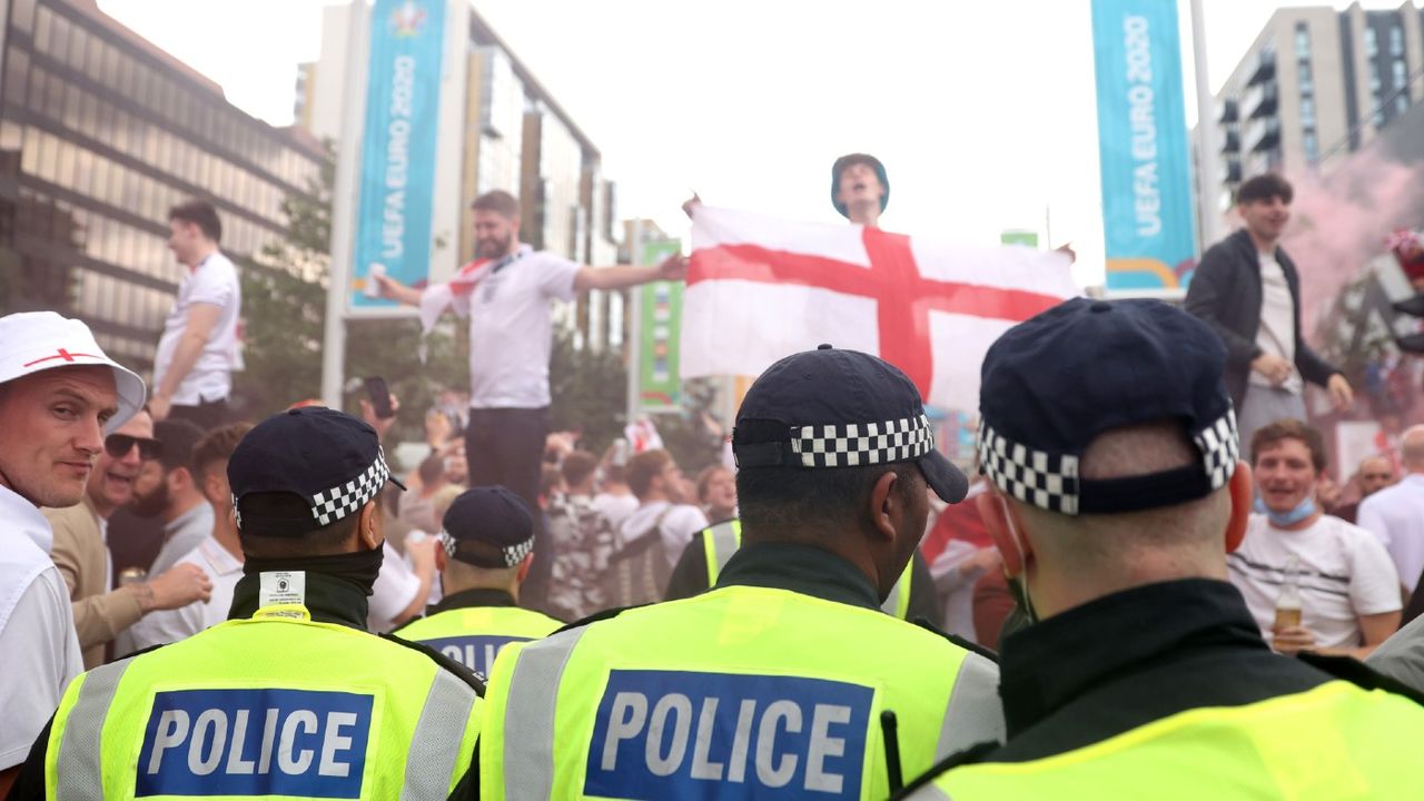 Police and England fans on Wembley Way ahead of the Euro 2020 final 