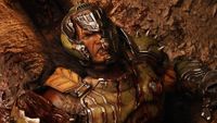 Doom: The Dark Ages - Doom Guy with his mask broken laying on the ground in the Revelations DLC