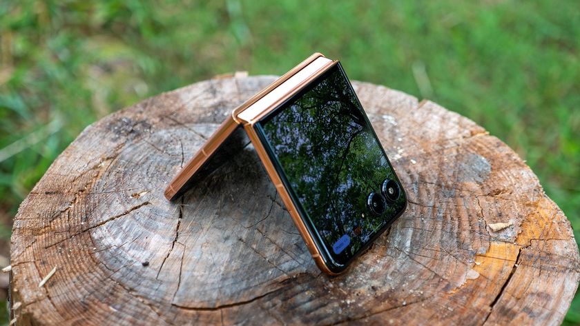 The Mocha Mousse Motorola Razr Plus 2025 tented on a stump