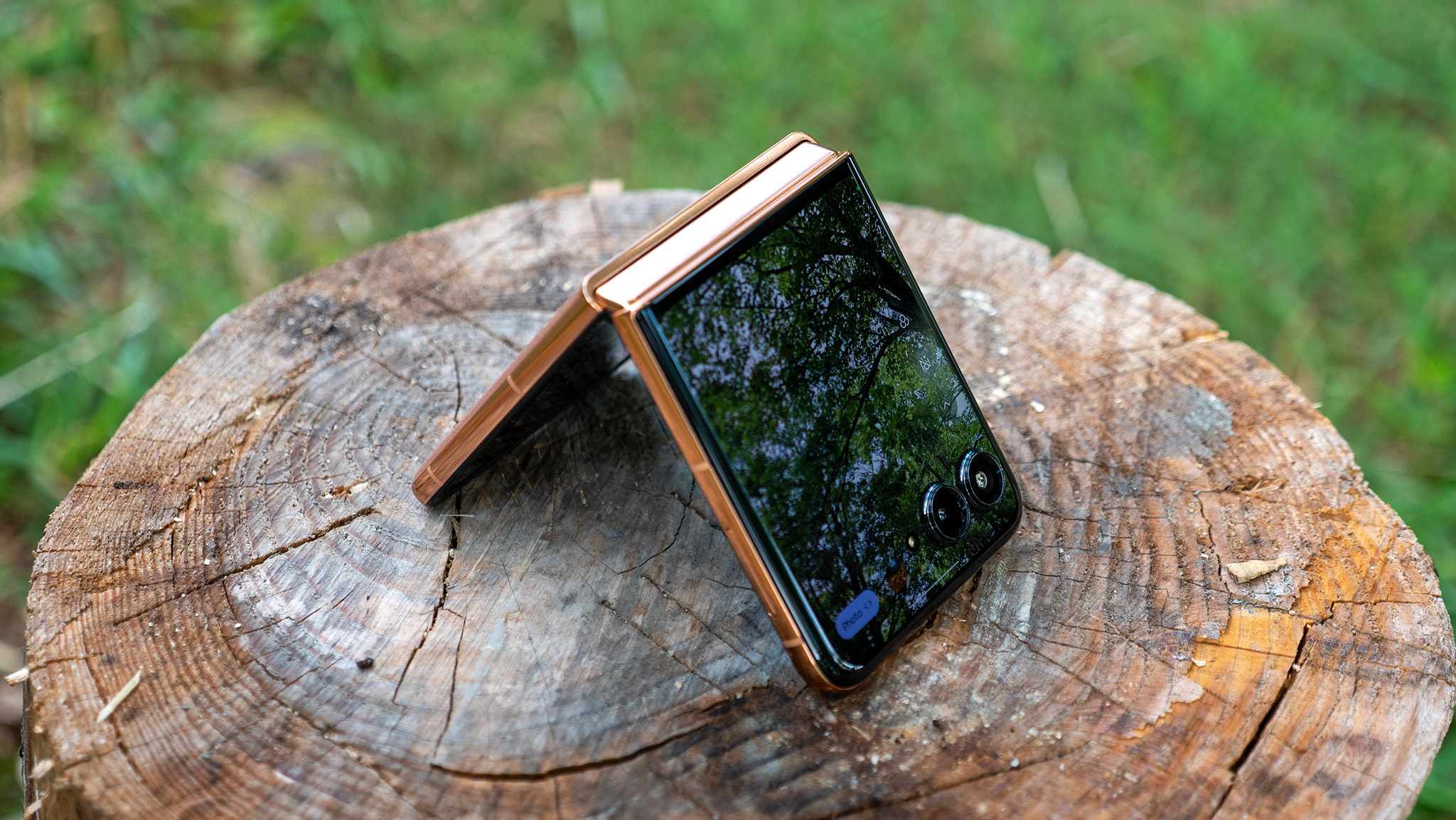 The Mocha Mousse Motorola Razr Plus 2025 tented on a stump