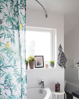 bathroom with white wall and window and curtains