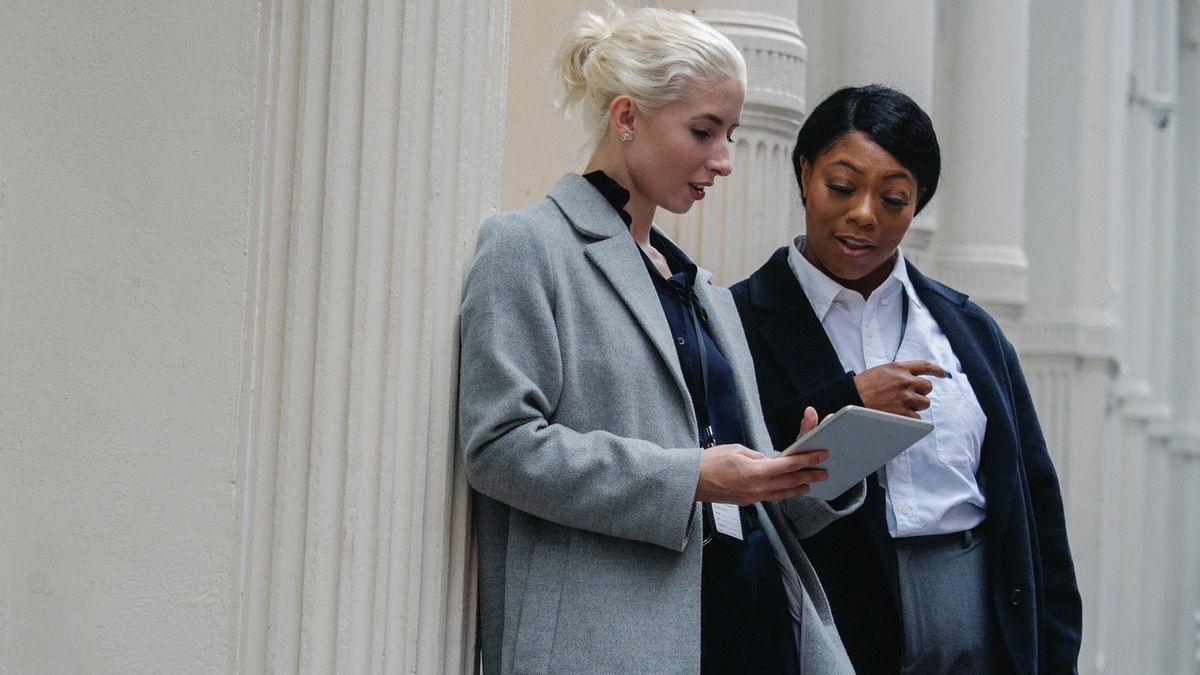 Two women looking at tablet computer