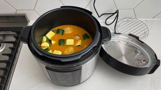 Crock-Pot Express full of curry on a kitchen countertop