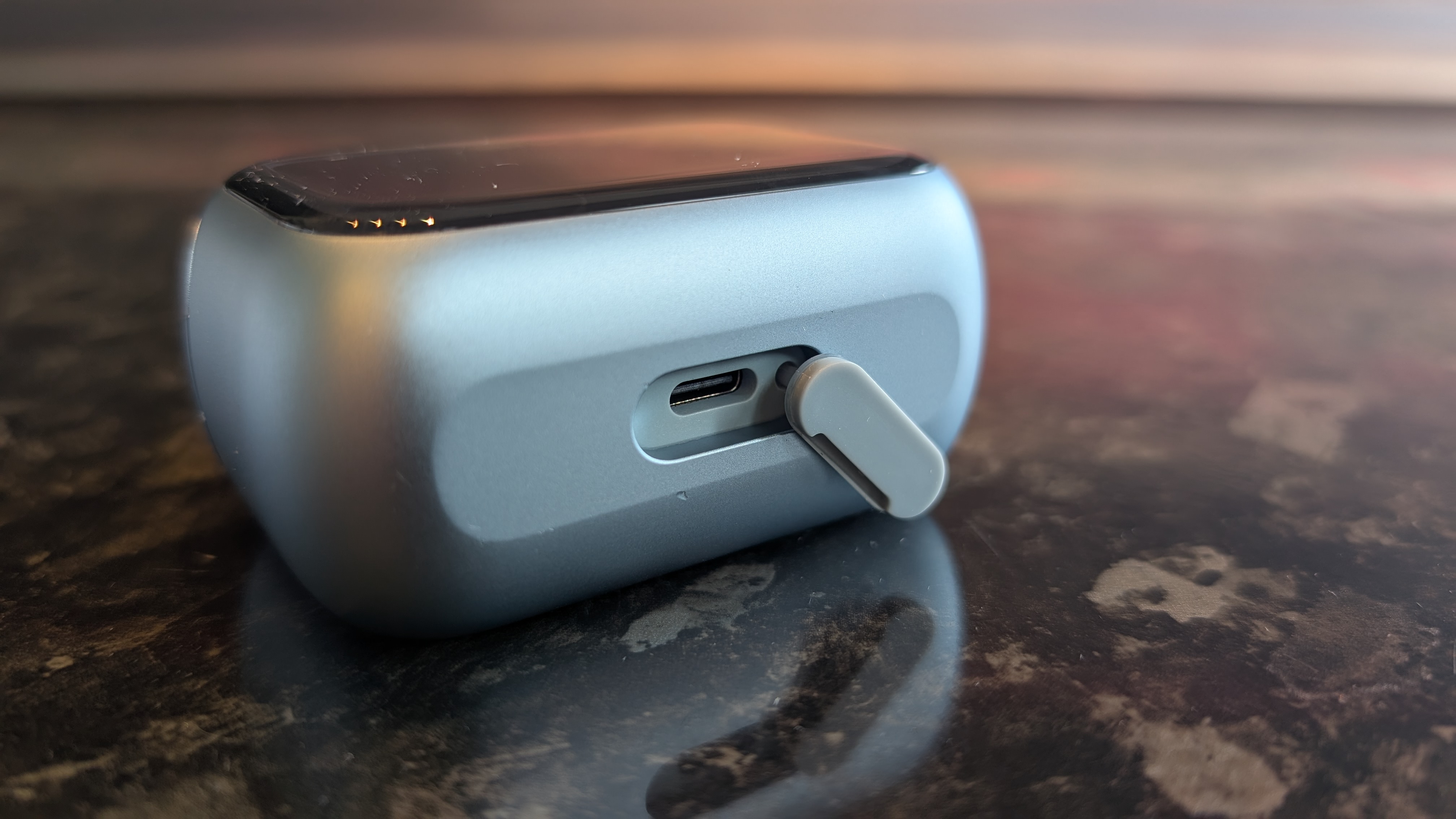 The Laifen P3 Pro electric travel shaver pictured on a dark marble worktop.