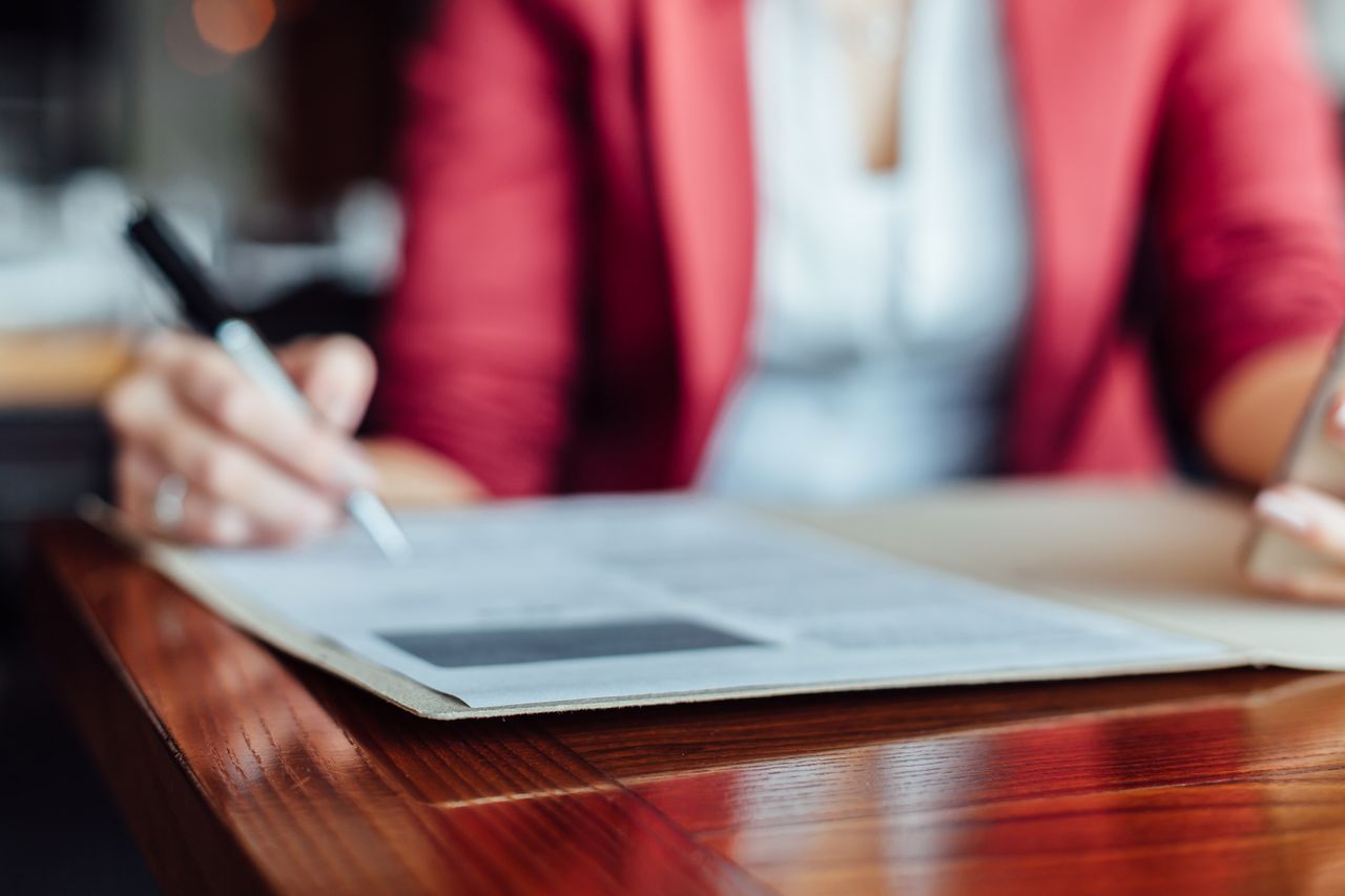 woman signing contract