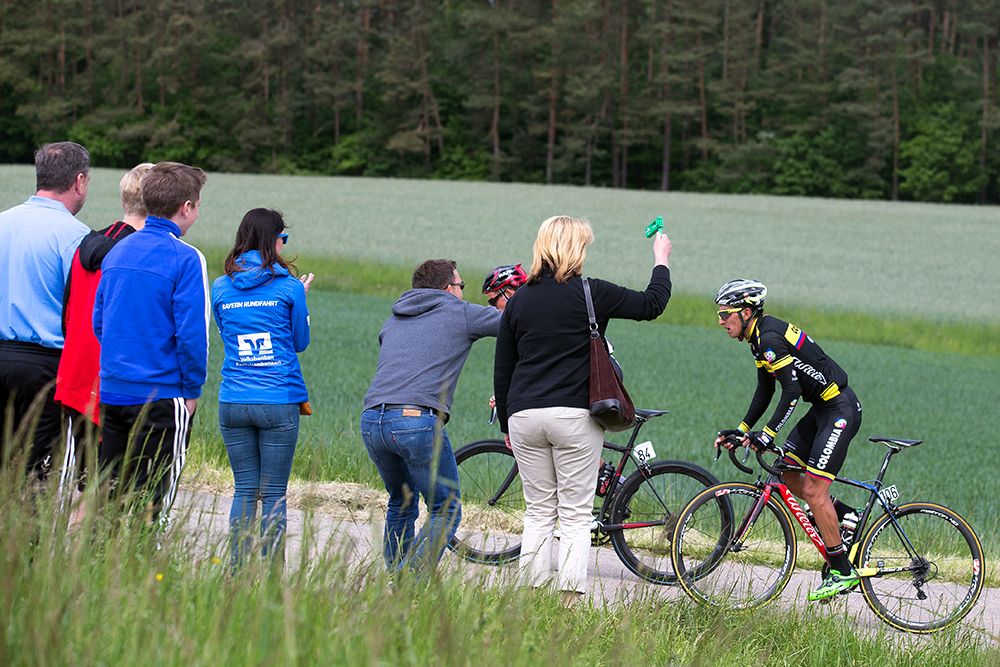 Fans cheers on the riders