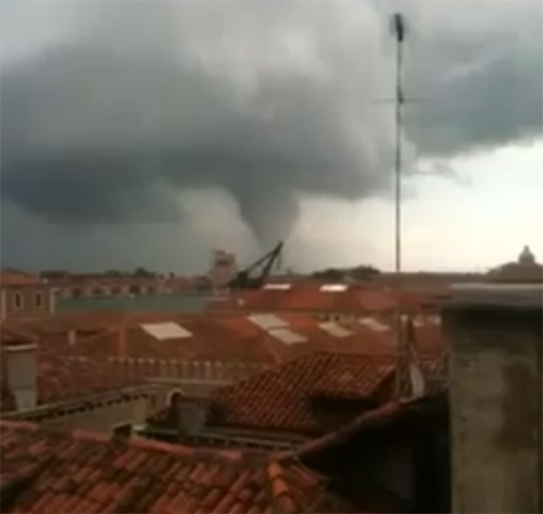 The twister spotted across city roofs.
