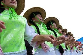 Local performers prepare for their routine in Danzhou.