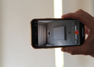 A iphone camera screen held up to a light