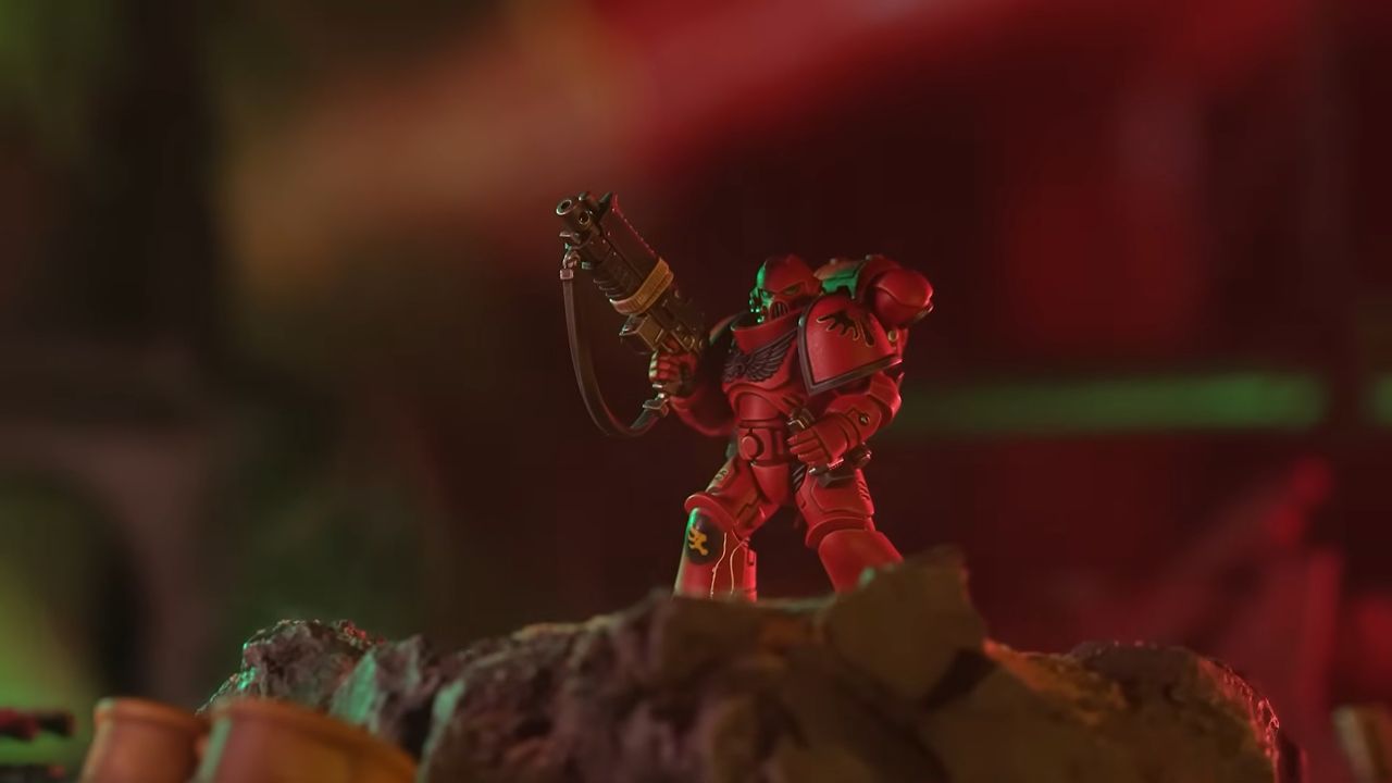 Warhammer Space Marine model on a dark, hazy battlefield