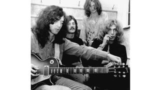 Led Zeppelin (L-R) Jimmy Page, John Bonham, John Paul Jones and Robert Plant pose for a photo backstage at the Lyceum Theatre on October 12, 1969 in London, England