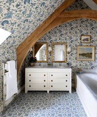 interior decorated with floral pattern bathroom with blue floral wallpaper