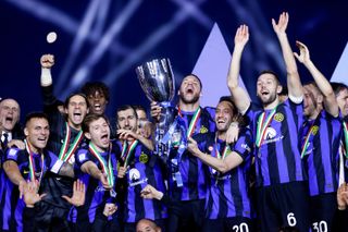 Inter players celebrate after beating Napoli to win the Supercoppa Italiana in January 2024.