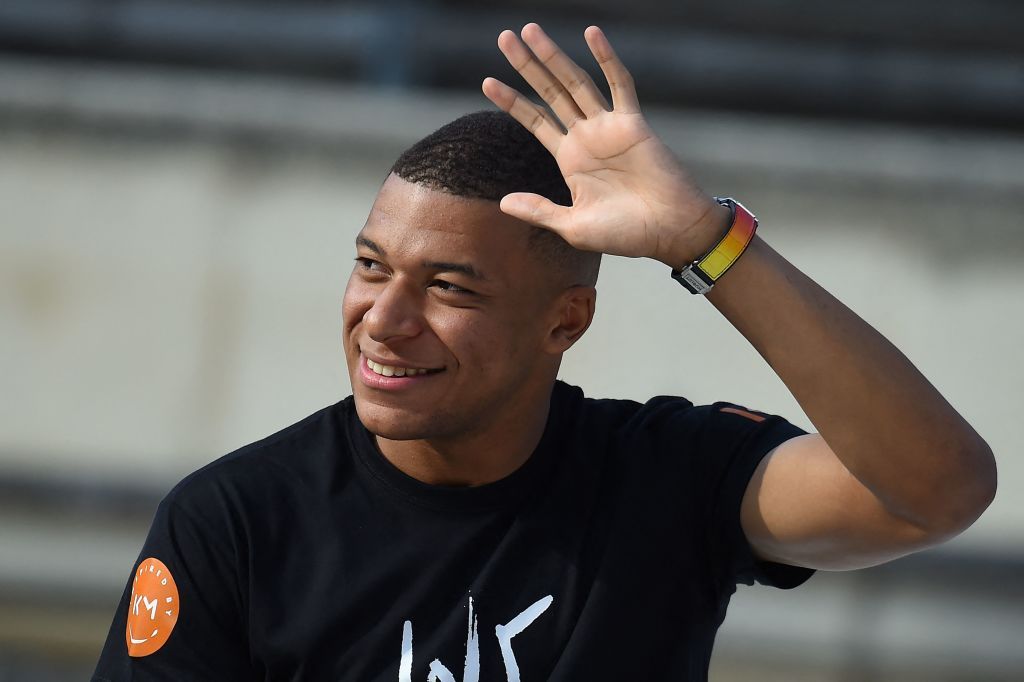 Liverpool target Kylian Mbappe waves to PSG supporters during &quot;Les rencontres inspirantes&quot; (inspiring meetings) organised by his association &quot;Inspired by KM&quot; at The Arena of Nimes, southern France, on October 12, 2022.