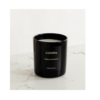 scented candle in black glass vessel
