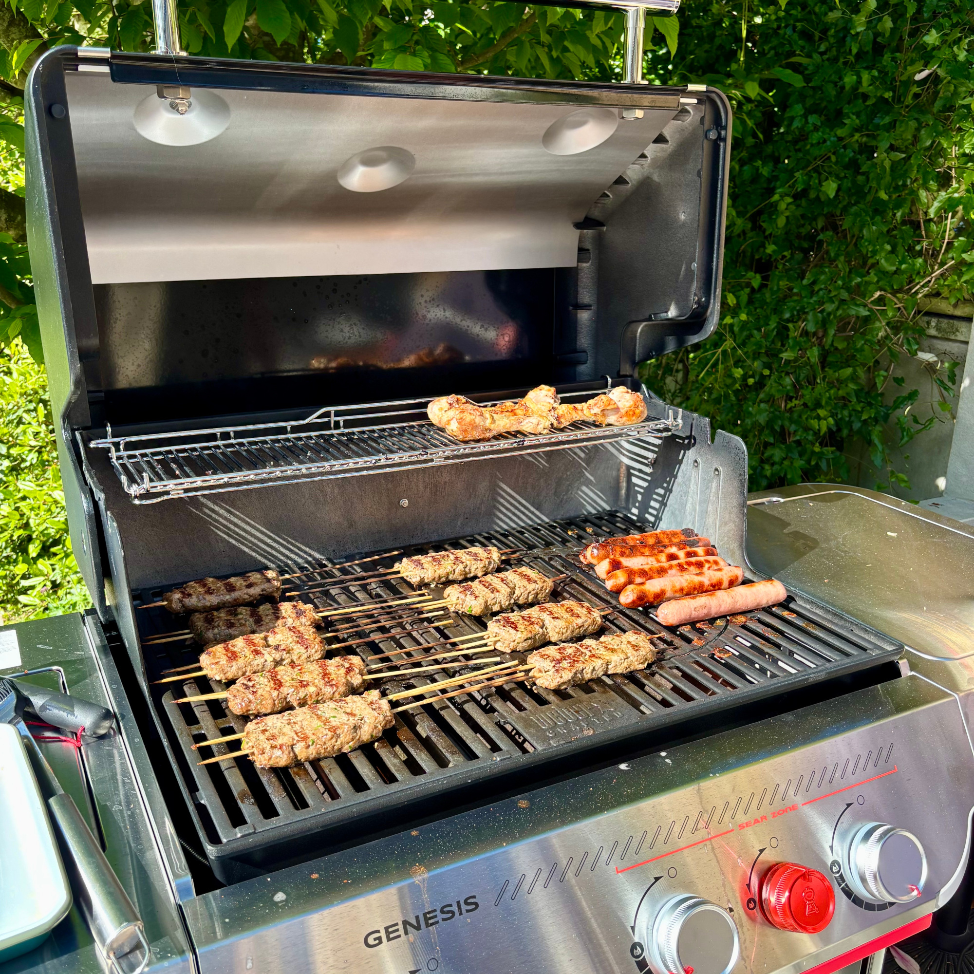 weber genesis EPX-335W Smart Gas Barbecue with kebabs and sausages