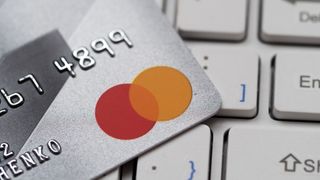 KIEV, UKRAINE - 2020/01/24: In this photo illustration the Bank cards mastercard on computer keyboard. (Photo Illustration by Igor Golovniov/SOPA Images/LightRocket via Getty Images)