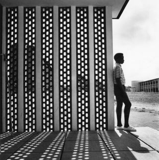Boy and concrete screen at University College Ibadan, 1962. Courtesy of RIBA