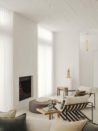 A living room with sheer curtains