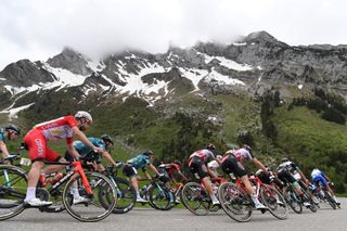The pack rides during the eighth stage of the 73rd edition of the Criterium du Dauphine cycling race a 147km between La LechereLesBains and Les Gets on June 6 2021 Photo by Alain JOCARD AFP Photo by ALAIN JOCARDAFP via Getty Images