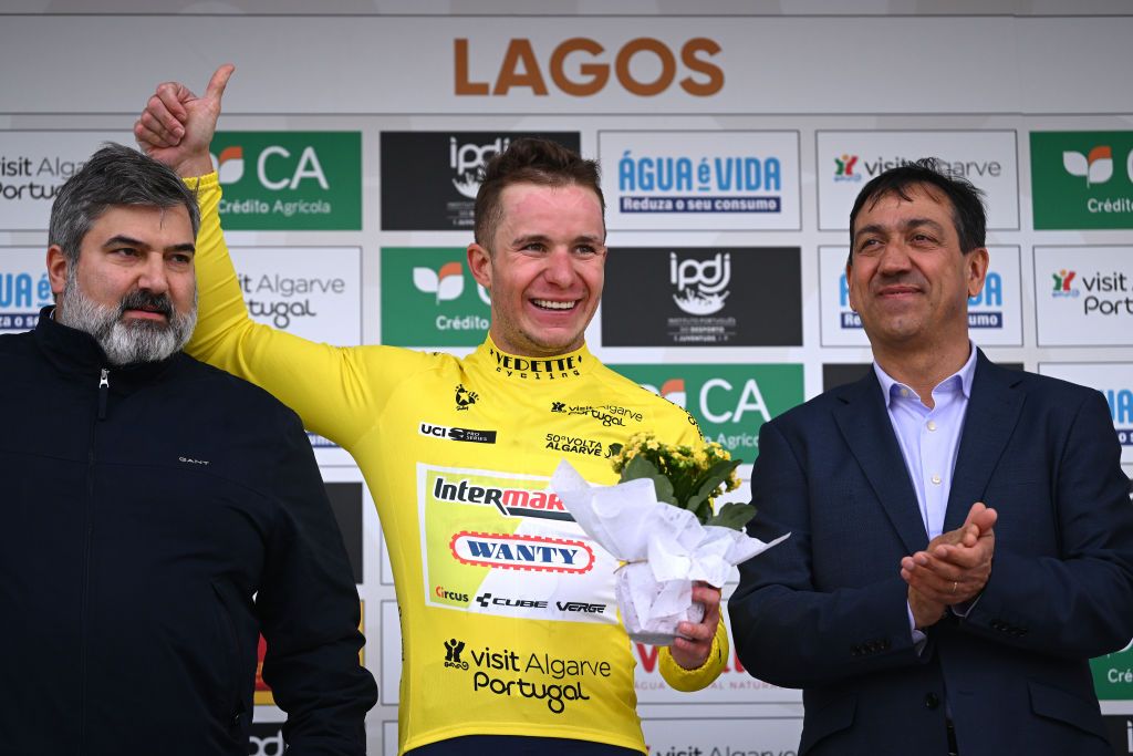 LAGOS PORTUGAL FEBRUARY 14 Gerben Thijssen of Belgium and Team Intermarche Wanty celebrates at podium as Yellow Leader Jersey winner with the presence of Delmino Albano Magalhes Pereira of Portugal President of the Portuguese Cycling Federation R during the 50th Volta ao Algarve em Bicicleta 2024 Stage 1 a 2008km stage from Portimao to Lagos on February 14 2024 in Lagos Portugal Photo by Dario BelingheriGetty Images