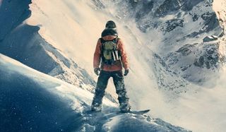 snowboarder on snowy cliff in steep
