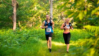 Man and woman running in ultra-marathon race