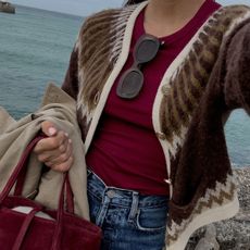 woman in burgundy tank and brown cardigan