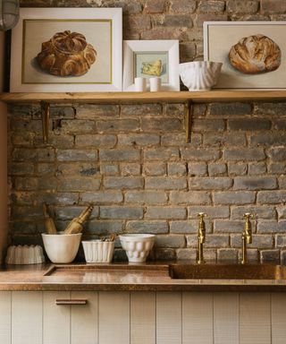 Modern rustic kitchen with brick wall