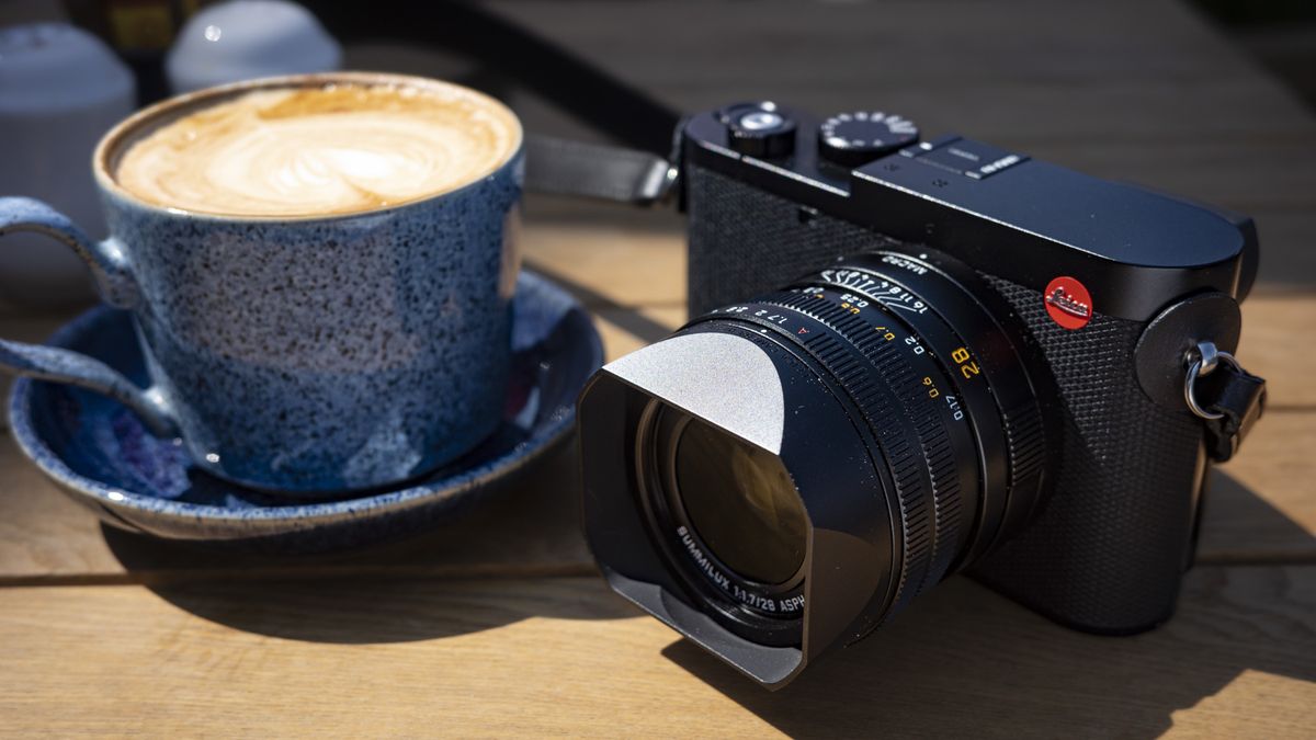 Leica Q3 camera on a wooden table