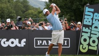 Brooks Koepka takes a tee shot at LIV Golf Greenbrier