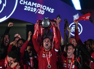 Liverpool captain Jordan Henderson lifts the Premier League trophy