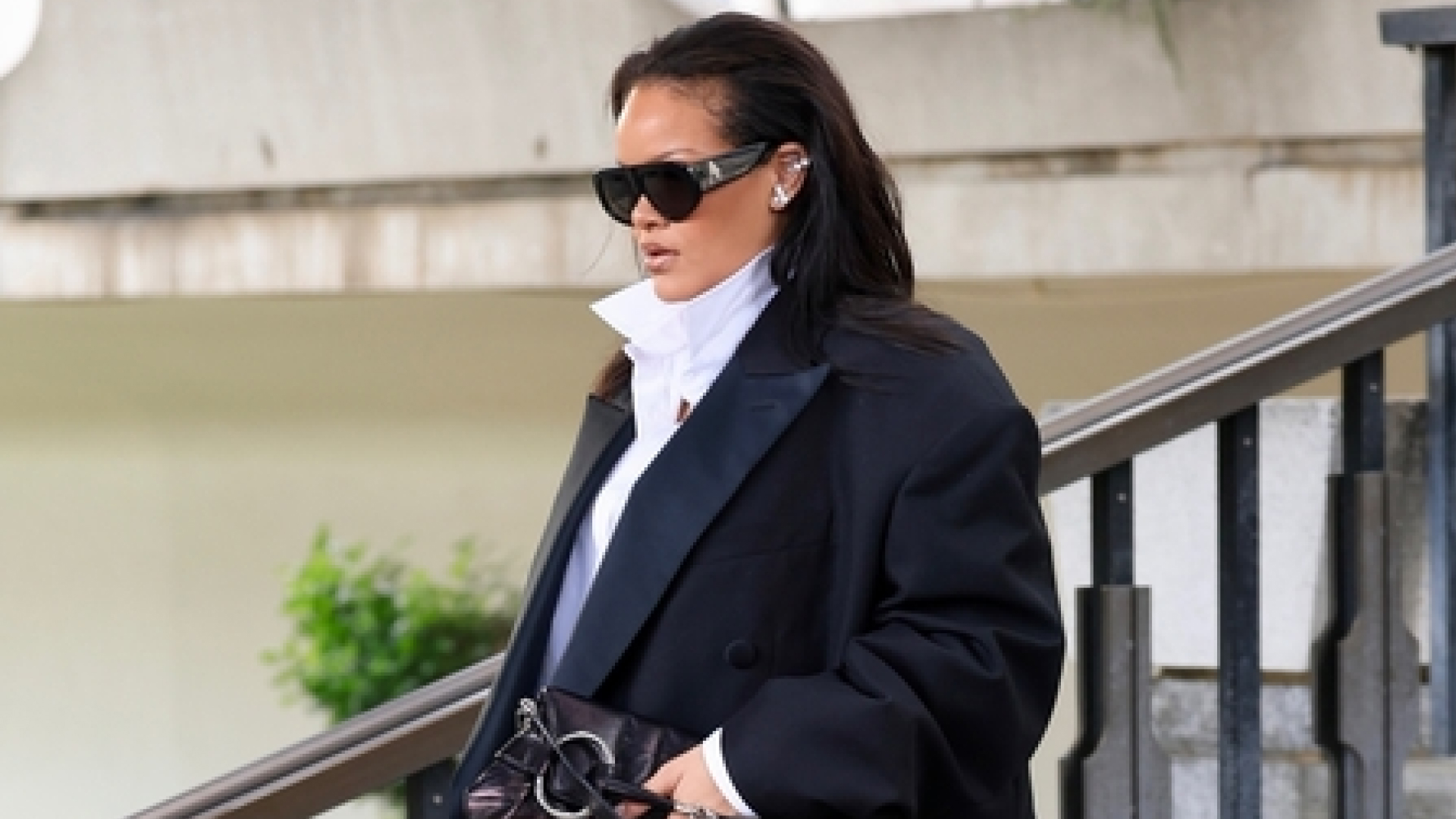 Rihanna wearing an oversize black blazer with her Gucci horsebit bag in California