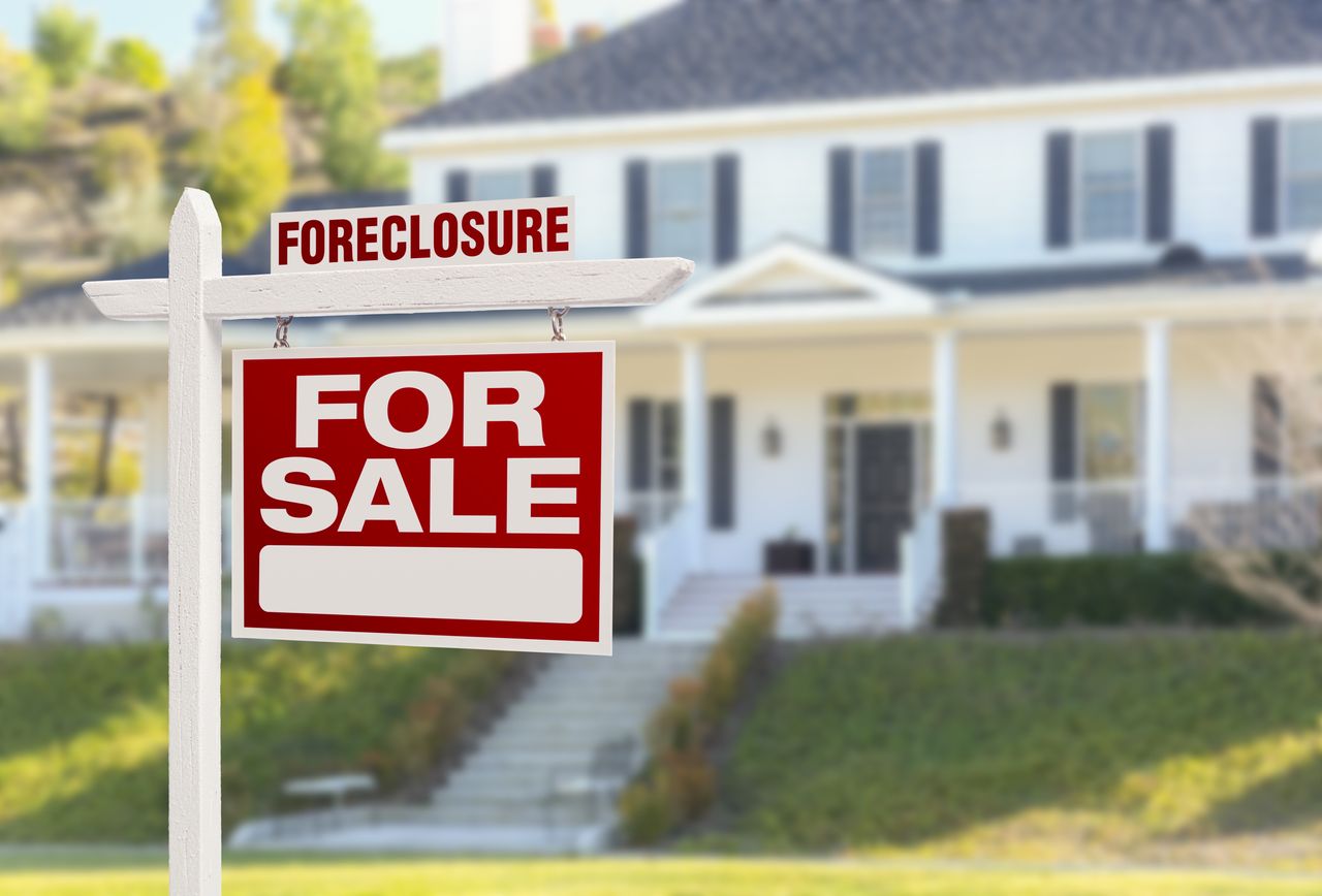 Foreclosure Home For Sale Sign in Front of Large House