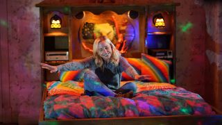 Becky grooving out in bed on The Conners