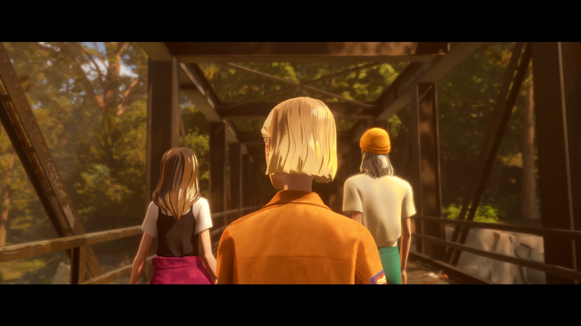 The trio of Mixtape walks across a bridge, away from the viewer.