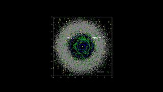 Image showing data gathered by NASA's Near-Earth Object Wide-field Survey Explorer (NEOWISE) investigation for the mission's first four years following its restart in December 2013. Green dots represent near-Earth objects. Gray dots represent all other asteroids, which are mostly in the main asteroid belt between Mars and Jupiter. Yellow squares represent comets.