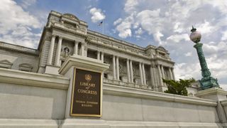 A photograph of the Library of Congress with the sign showing