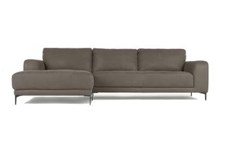 A grey leather chaise corner sofa with black metal stiletto legs