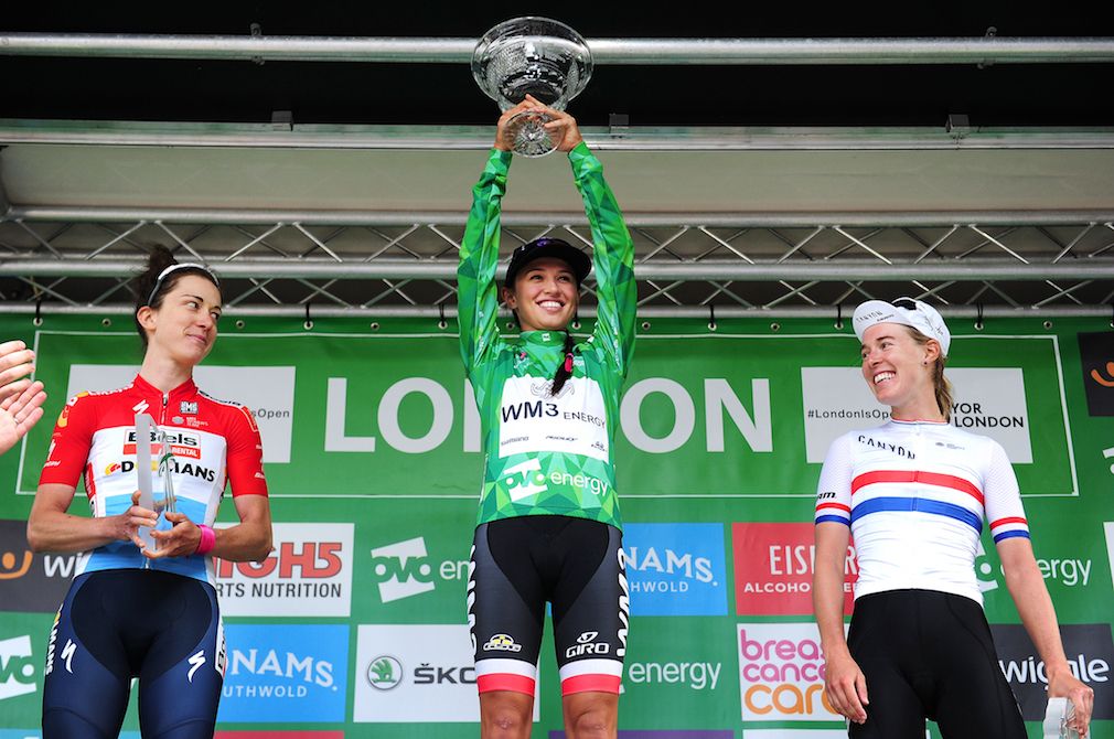 Katarzyna Niewiadoma holds her Ovo Energy Women's Tour trophy high.