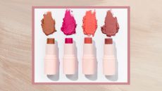 A frame containing an image of four sticks of cream blusher, one beige, one pink, one coral and one dusky pink, each twisted up with a smudge of product