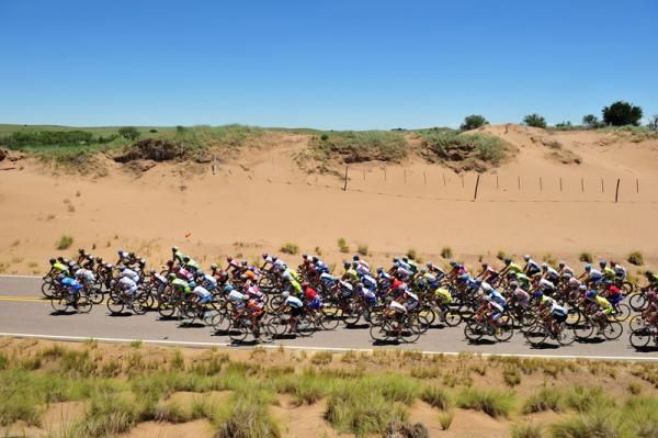 The San Luis peloton makes their way through a cutting in Argentina