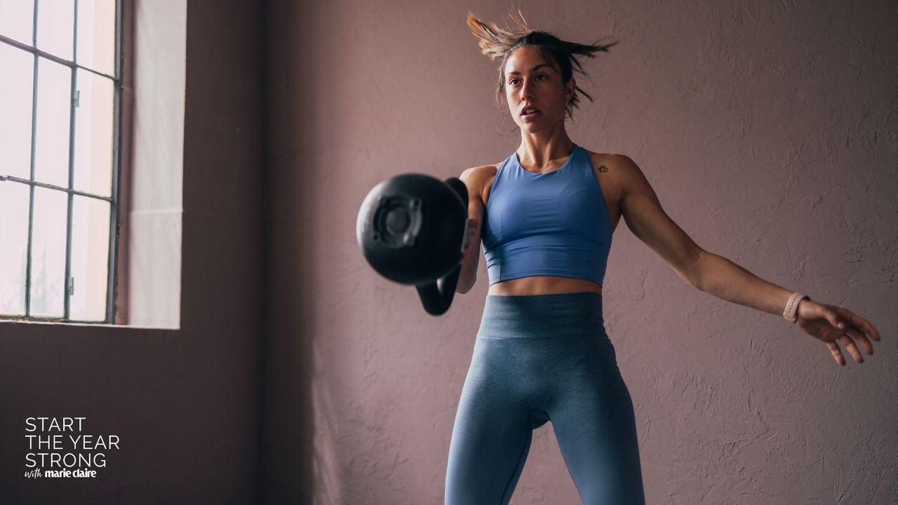 A woman doing a kettlebell swing workout