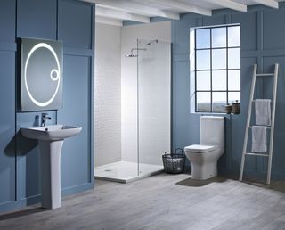 blue bathroom with white sanitaryware from Pure Bathroom Collection
