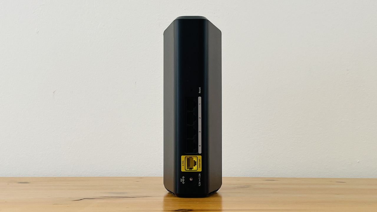 Netgear Nighthawk RS100 router on wooden table